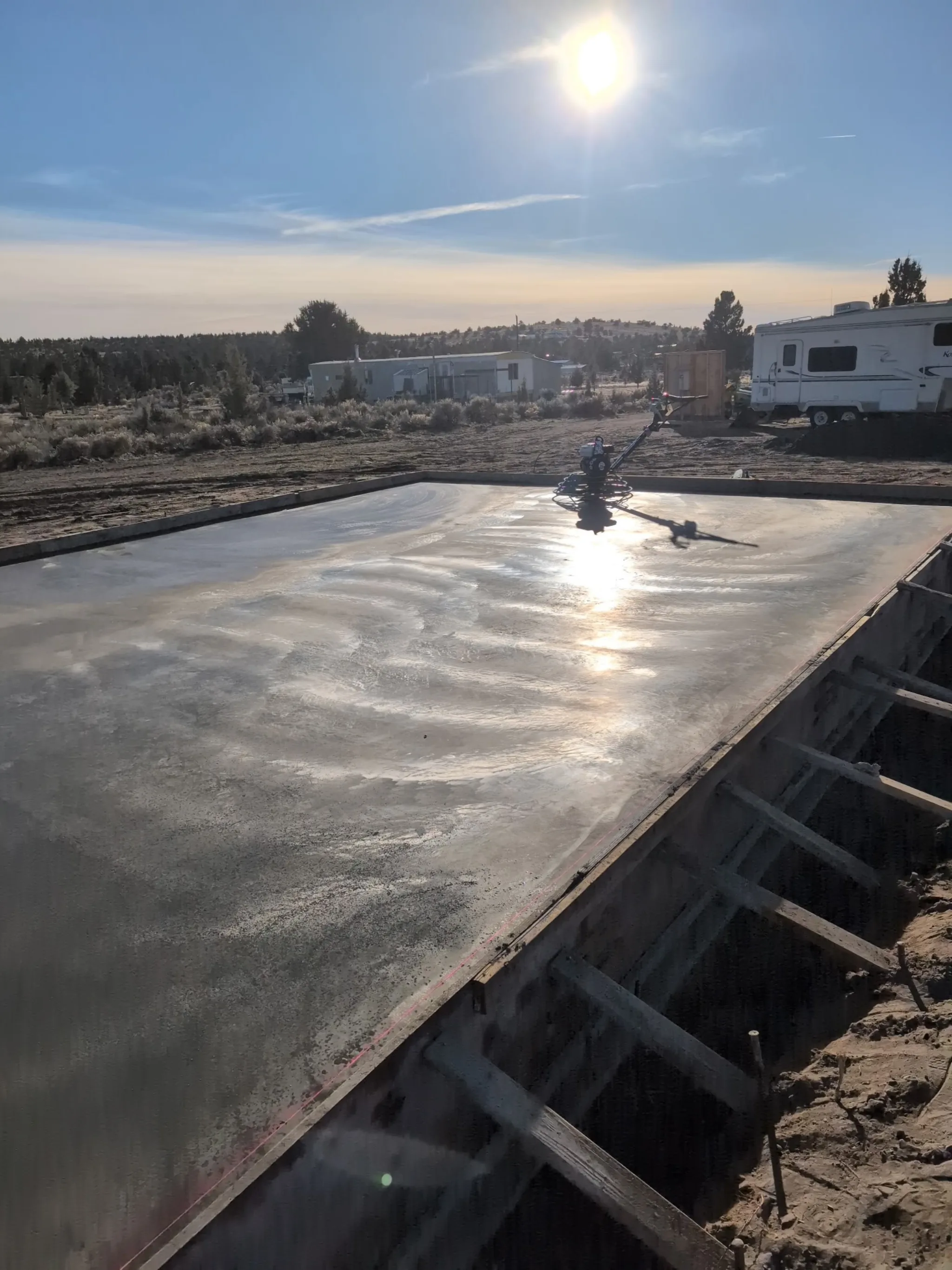 Cured mono slab in a Prineville field, blue sky overhead