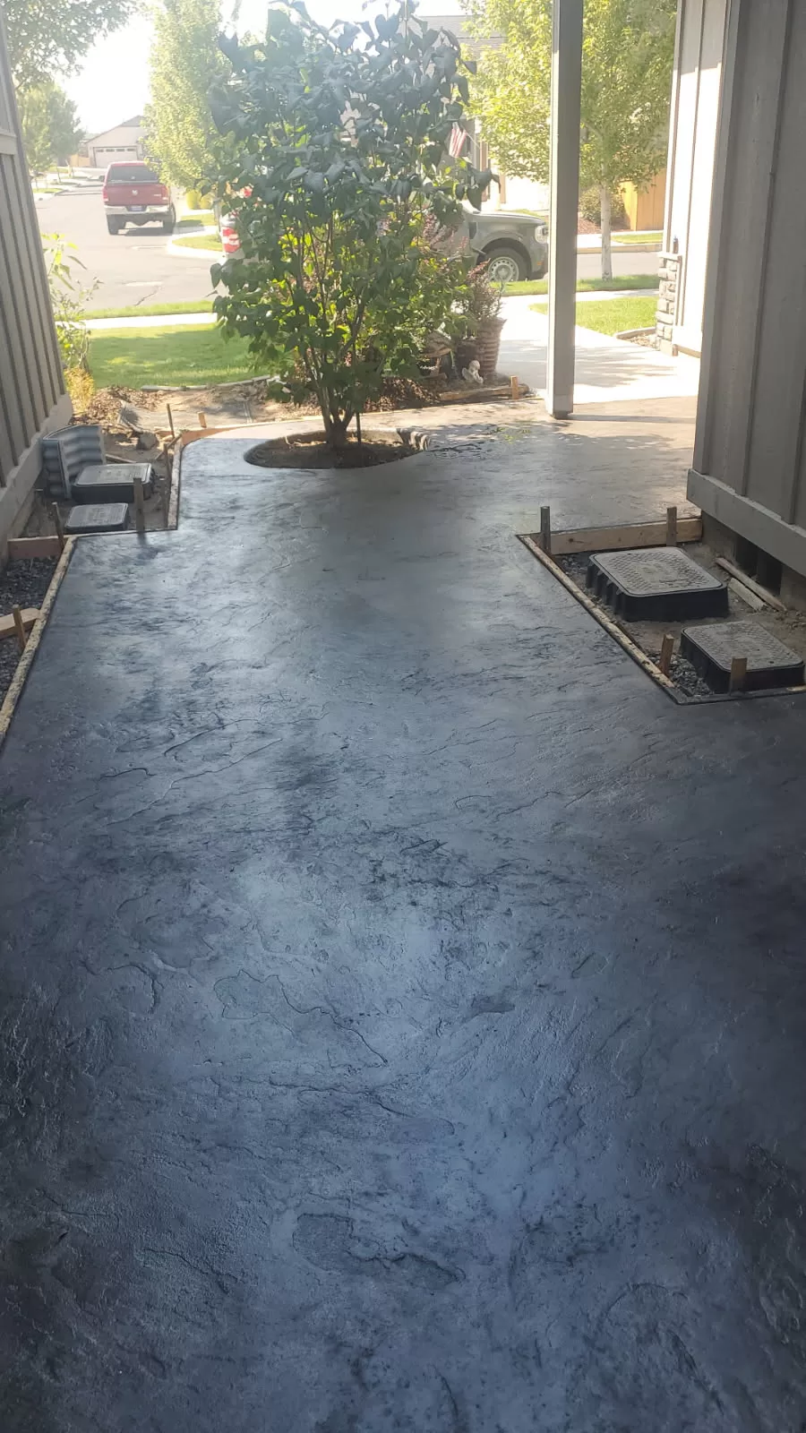 Stamped concrete entryway with dark integral color
